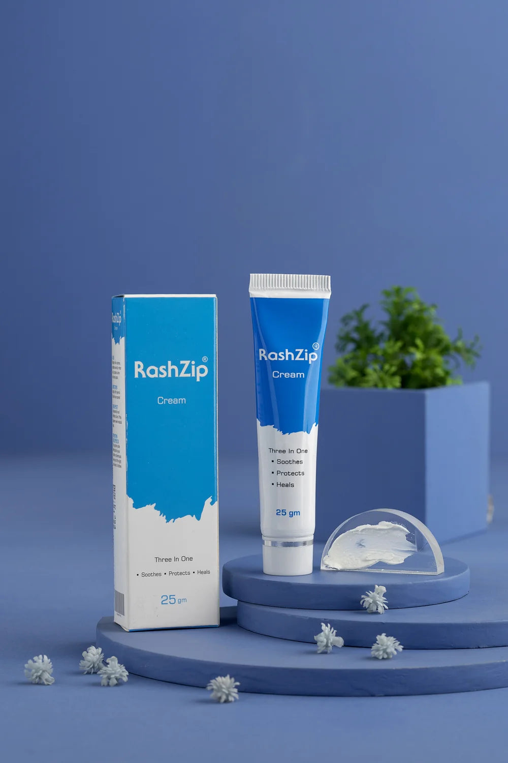 RashZip Cream 25 gm box and tube on blue display