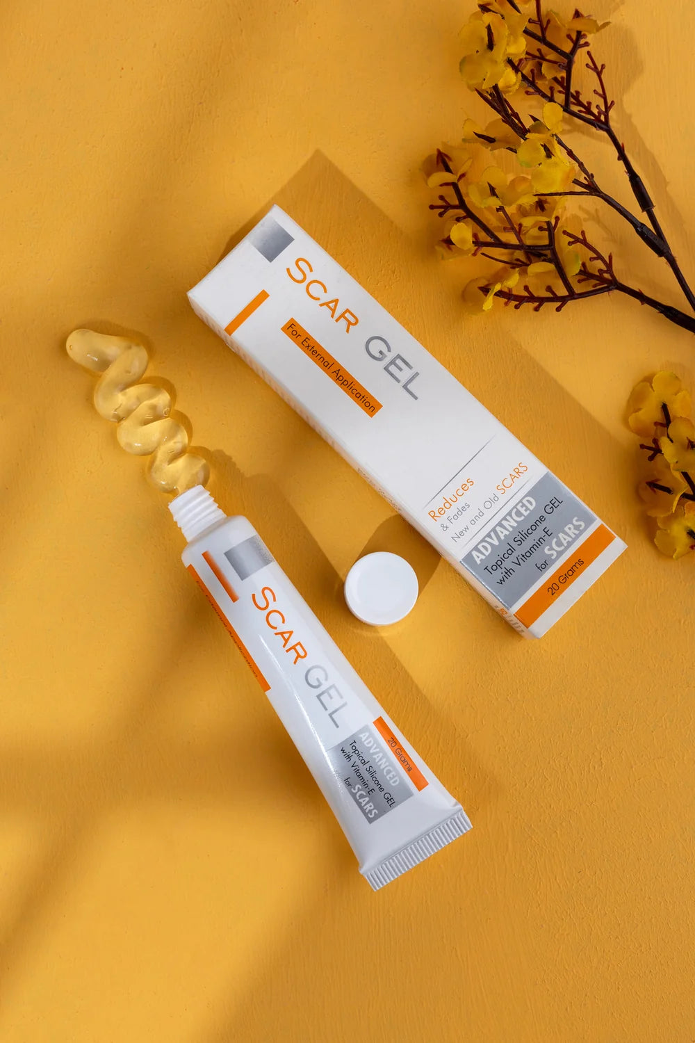 CAPEX Scar Gel 20 grams box and open tube on orange background